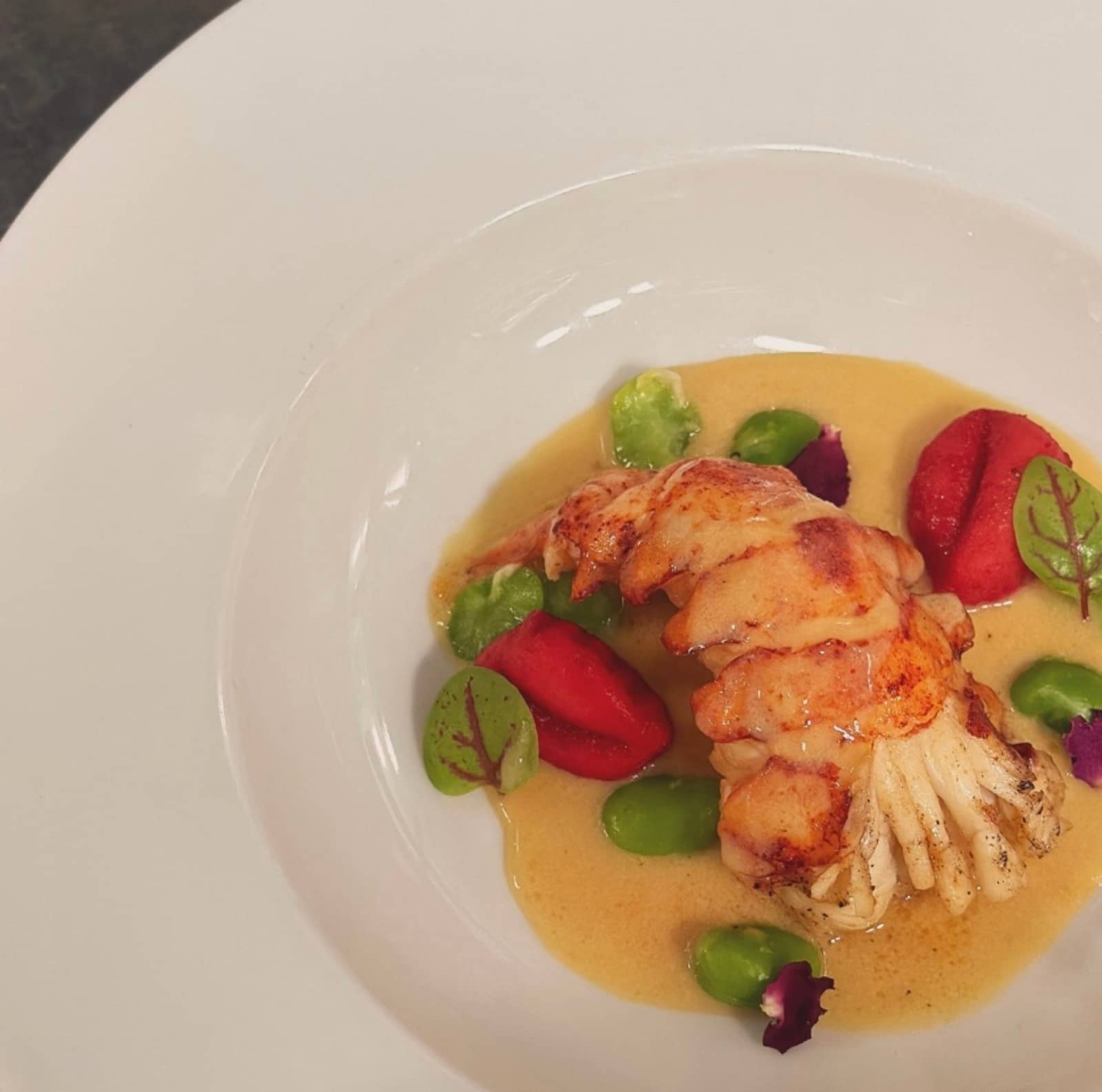 Seared tail, broad beans, red pepper and a butter sauce.