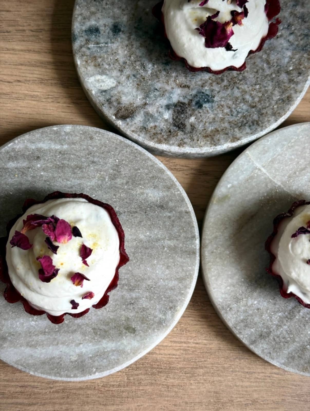Berry shells, whipped cream, dried petals.