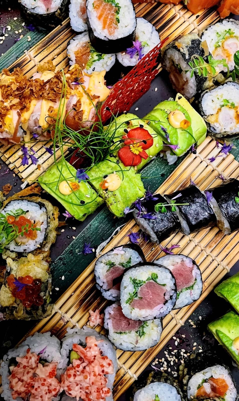 A composed selection of rolls, from avocado to tuna.