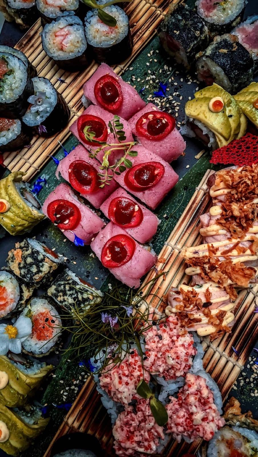 Pink tuna, cherry and a full sushi board.