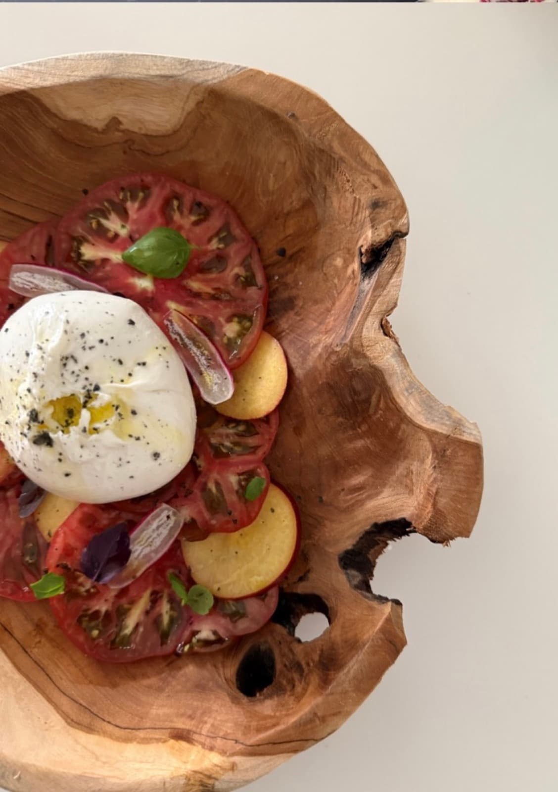 Late-summer salad in a walnut bowl.