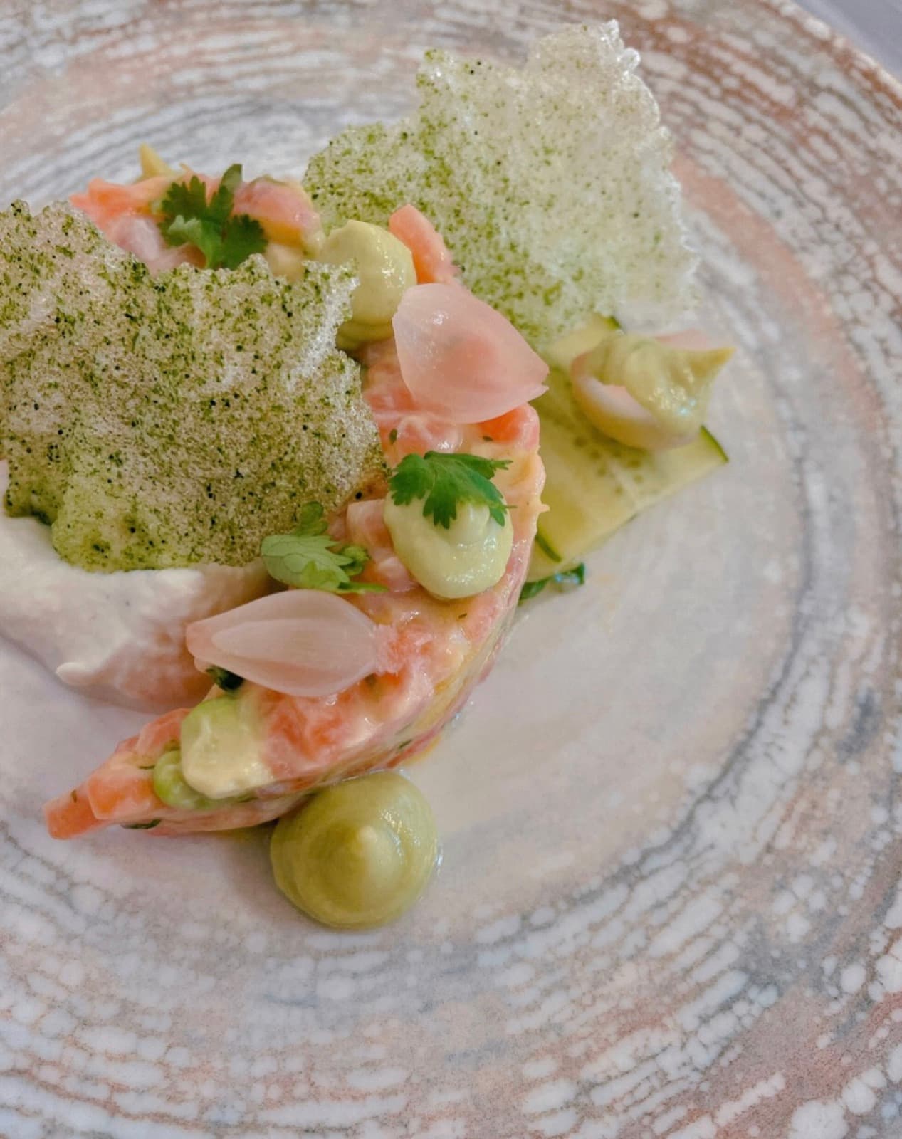 Avocado cream, herb tuile, shallot petals.